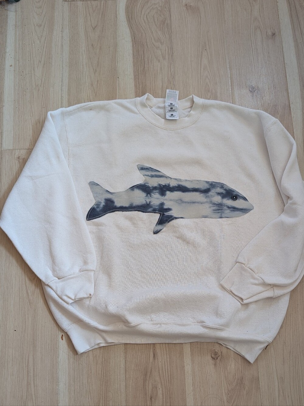 Cream Crewneck Sweatshirt with Blue Tie-Dye Shark Graphic